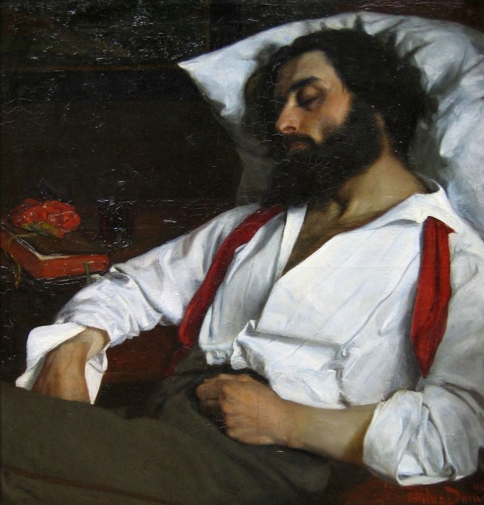 A man with a beard and long hair sleeps peacefully on a pillow, wearing a white shirt with red suspenders. A book and strawberries are placed on a table beside him.